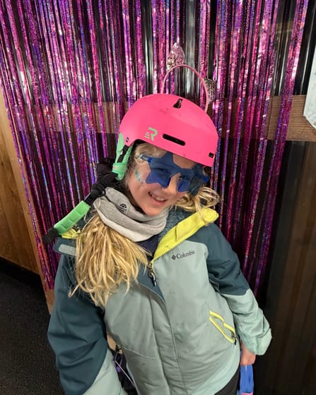 Kid in bright ski gear — Denise Schnider